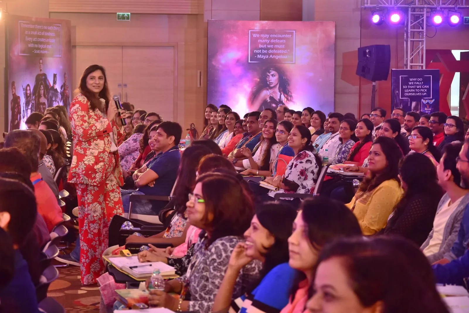 Nidhi Raina speaking to a seated audience during a Personal Excellence gathering