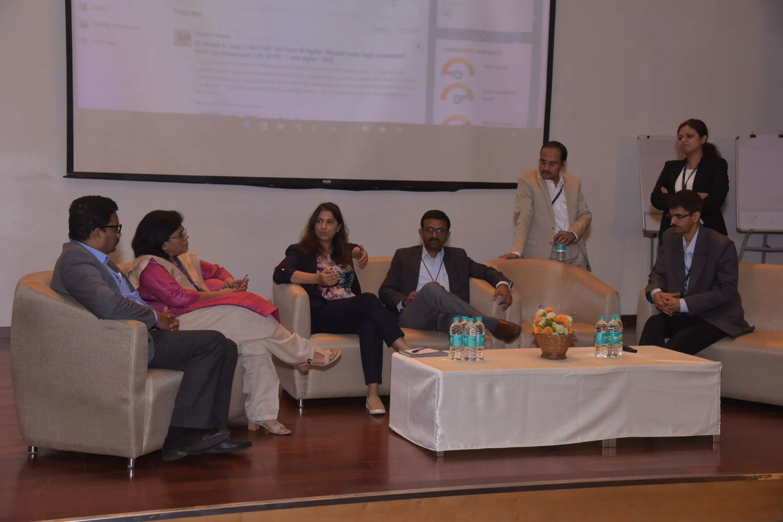 Nidhi Raina speaking to an audience at a professional event